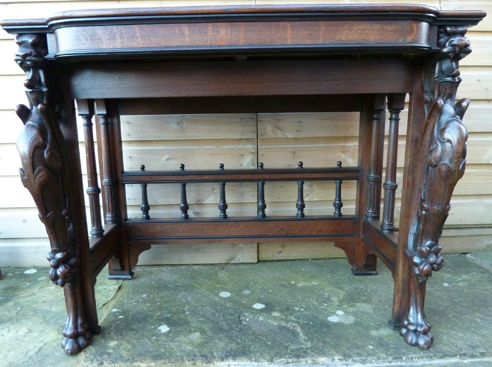 VICTORIAN OAK WRITING TABLE WITH GRIFFIN MOUNTS View IX