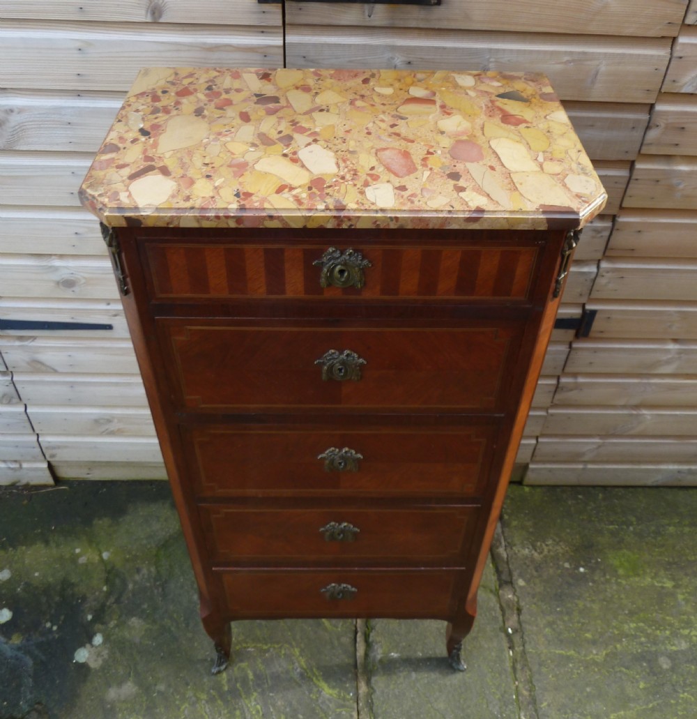 A tall French semainier chest of drawers featuring five inlaid timber drawers, bronze escutcheons, cabriole legs, and a marble top. View V