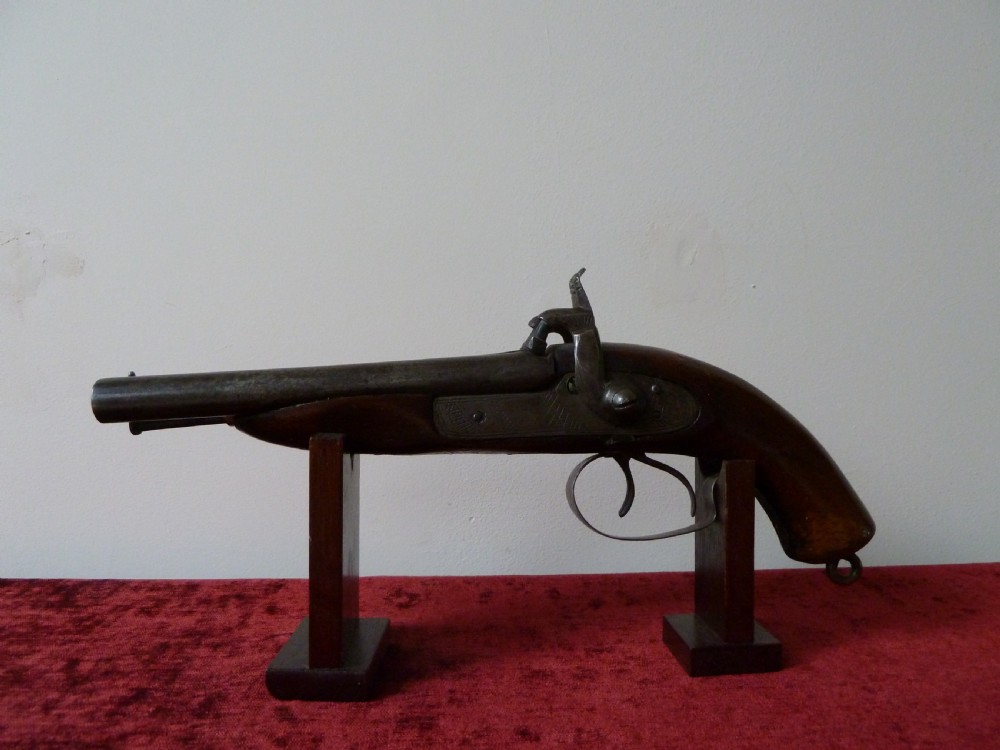 A 19th-century double-barrel percussion pistol featuring side-by-side steel barrels, dual hammers, engraved lockplates, and a smooth walnut stock. View III