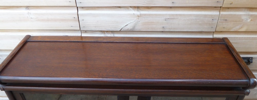 A four-tier dark oak Globe Wernicke sectional bookcase featuring glazed lift-up doors and a plinth base. View IV