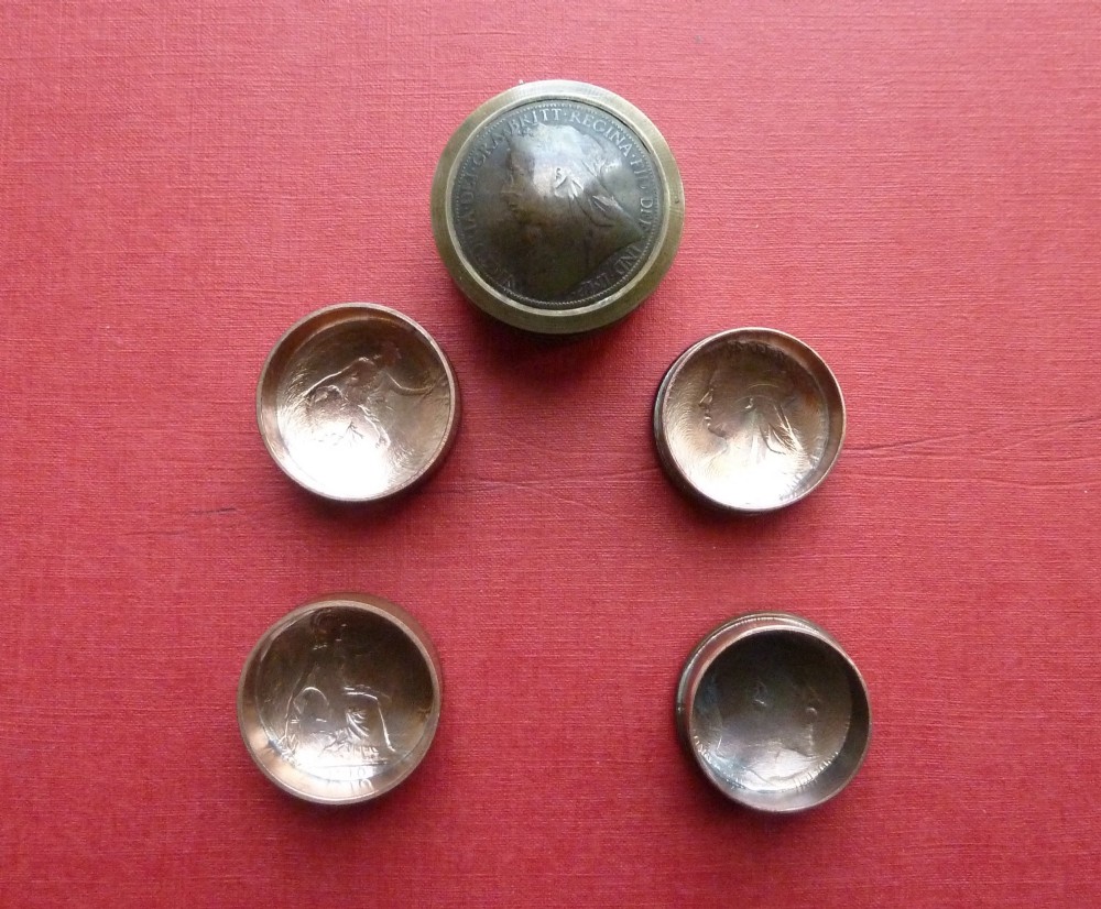 Three small circular antique brass snuff boxes with lids featuring raised profile portraits of British monarchs. View II