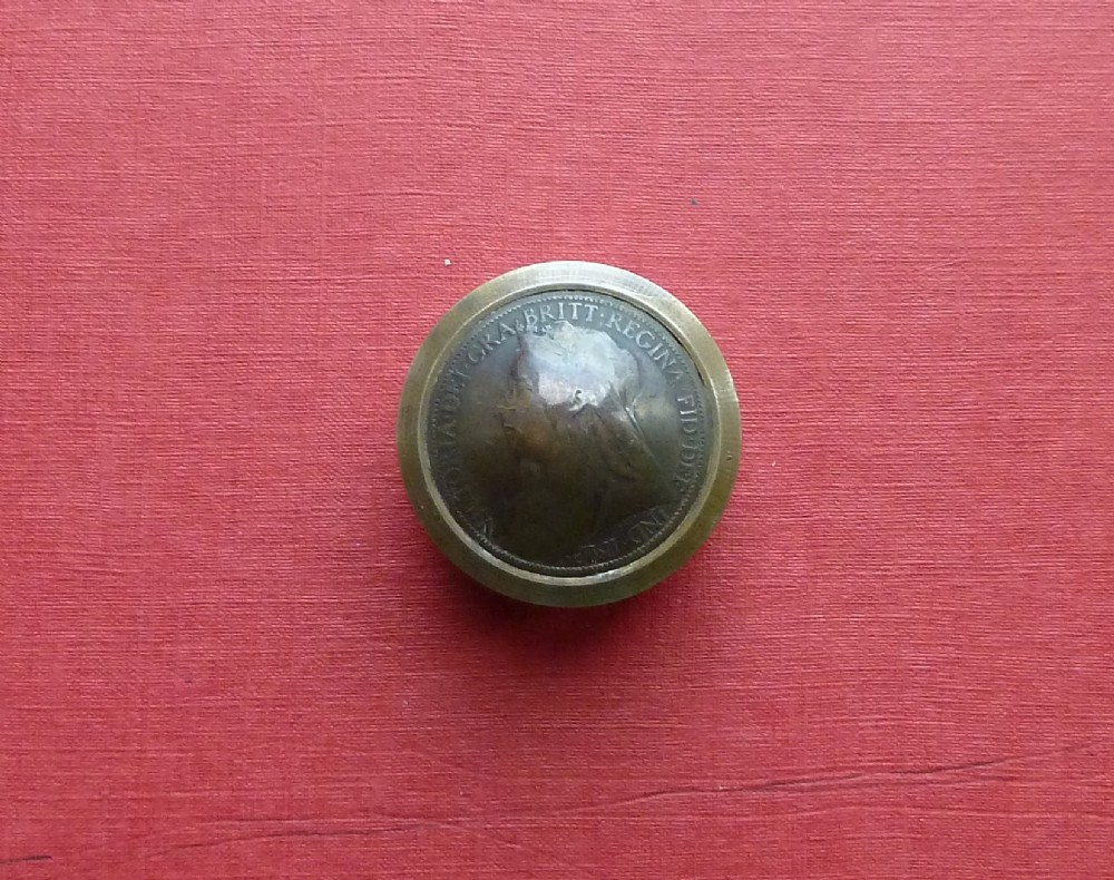 Three small circular antique brass snuff boxes with lids featuring raised profile portraits of British monarchs. View III