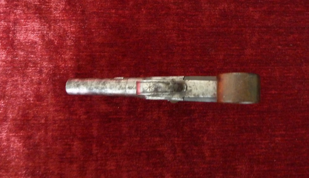 An 18th-century Georgian flintlock pocket pistol featuring an engraved steel lock mechanism, short round barrel, and smooth wooden grip. View V