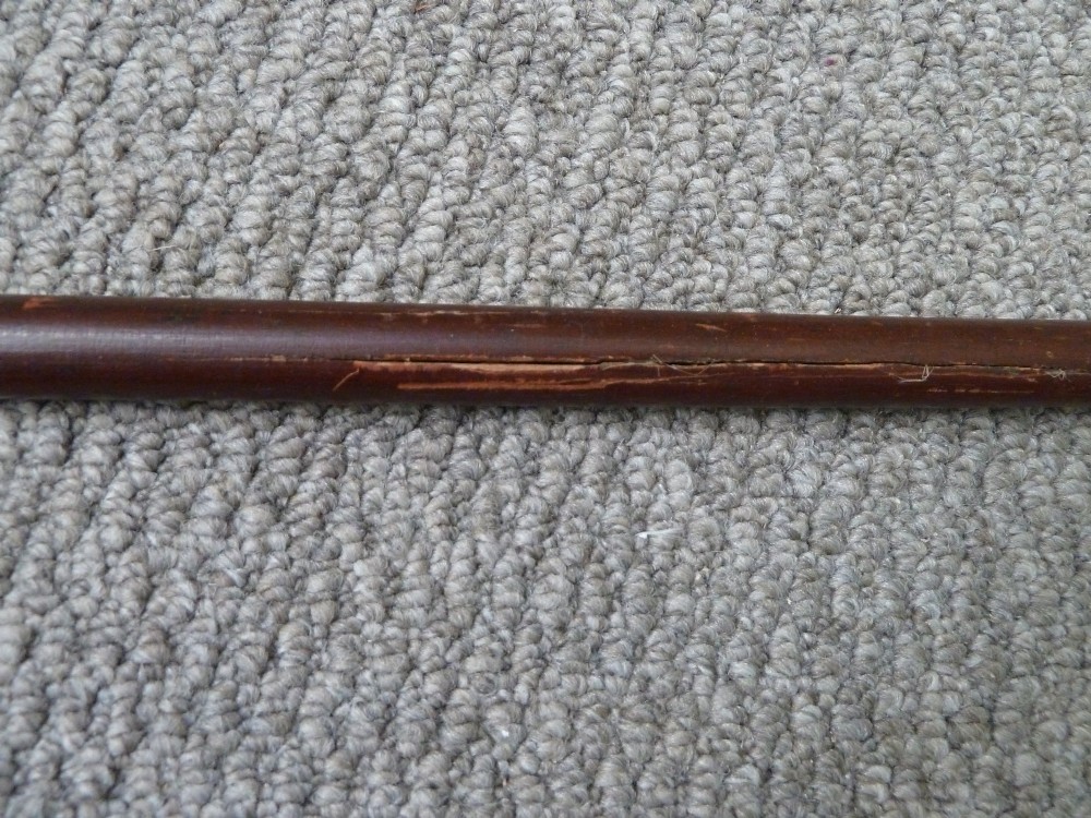 A Victorian sword stick displayed unsheathed in two parts, showcasing a stag horn handle, decorative metal ferrule, dark wooden scabbard, and a narrow steel blade. View VIII