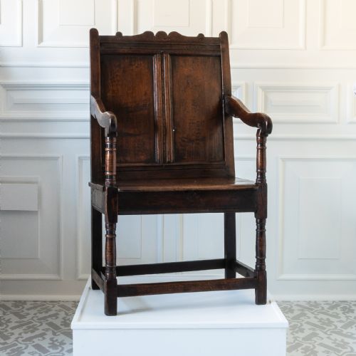 A Charles II joined oak double-panel back open armchair, circa 1660