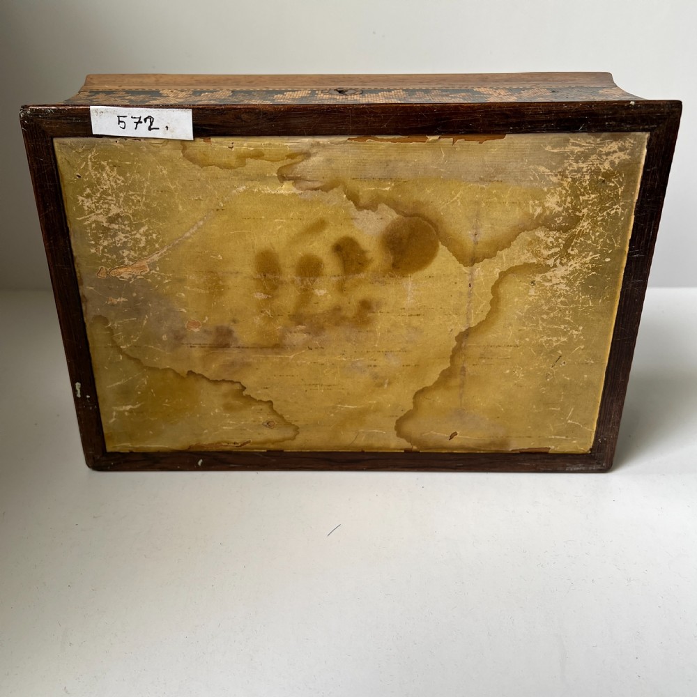 A rectangular Victorian Tunbridge ware wooden box featuring flared concave sides, a hinged lid decorated with an inlaid landscape, and leaf mosaic borders. View VIII