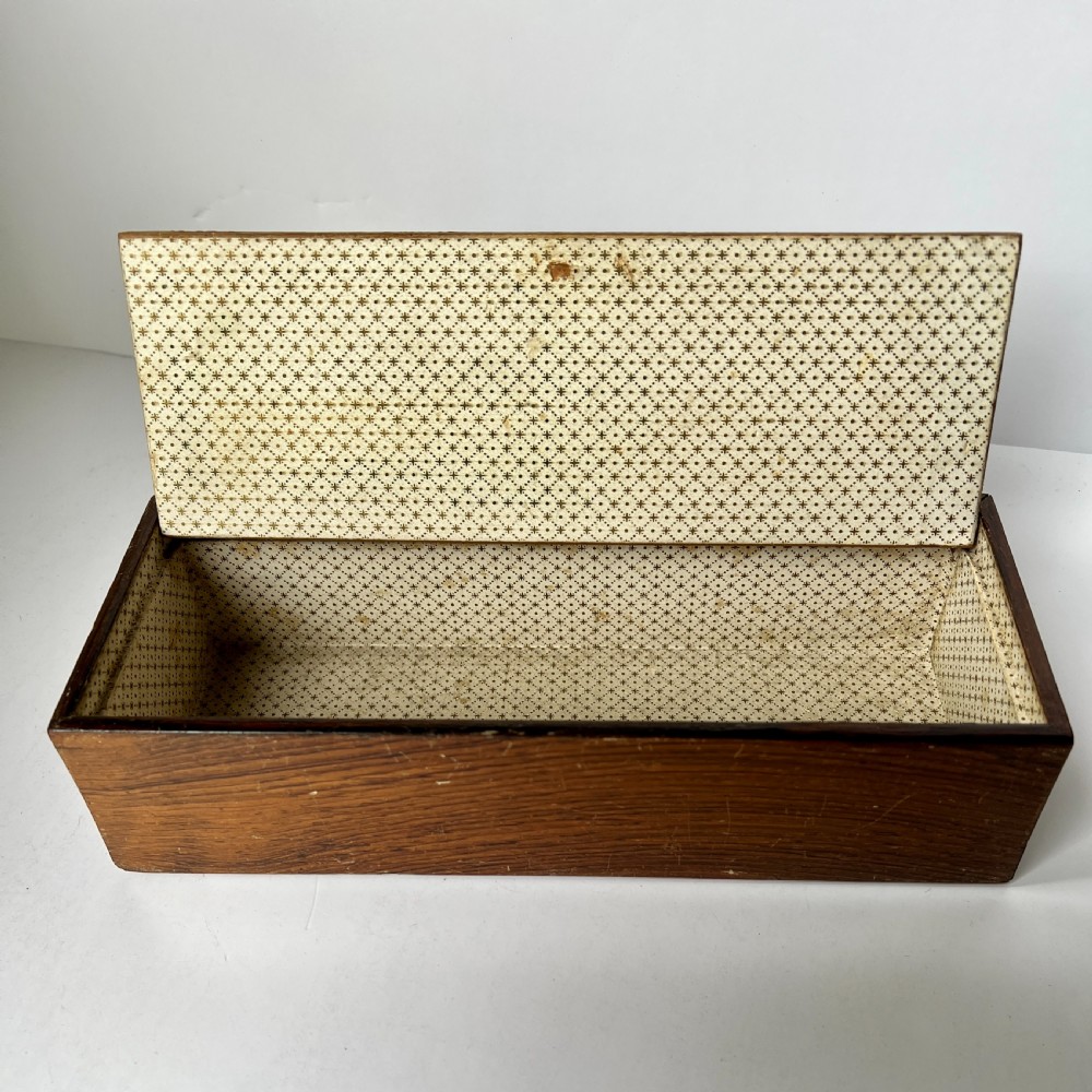 A Victorian Tunbridge ware rectangular wooden glove box featuring intricate geometric tessellated wood marquetry and a small turned knob. View IV