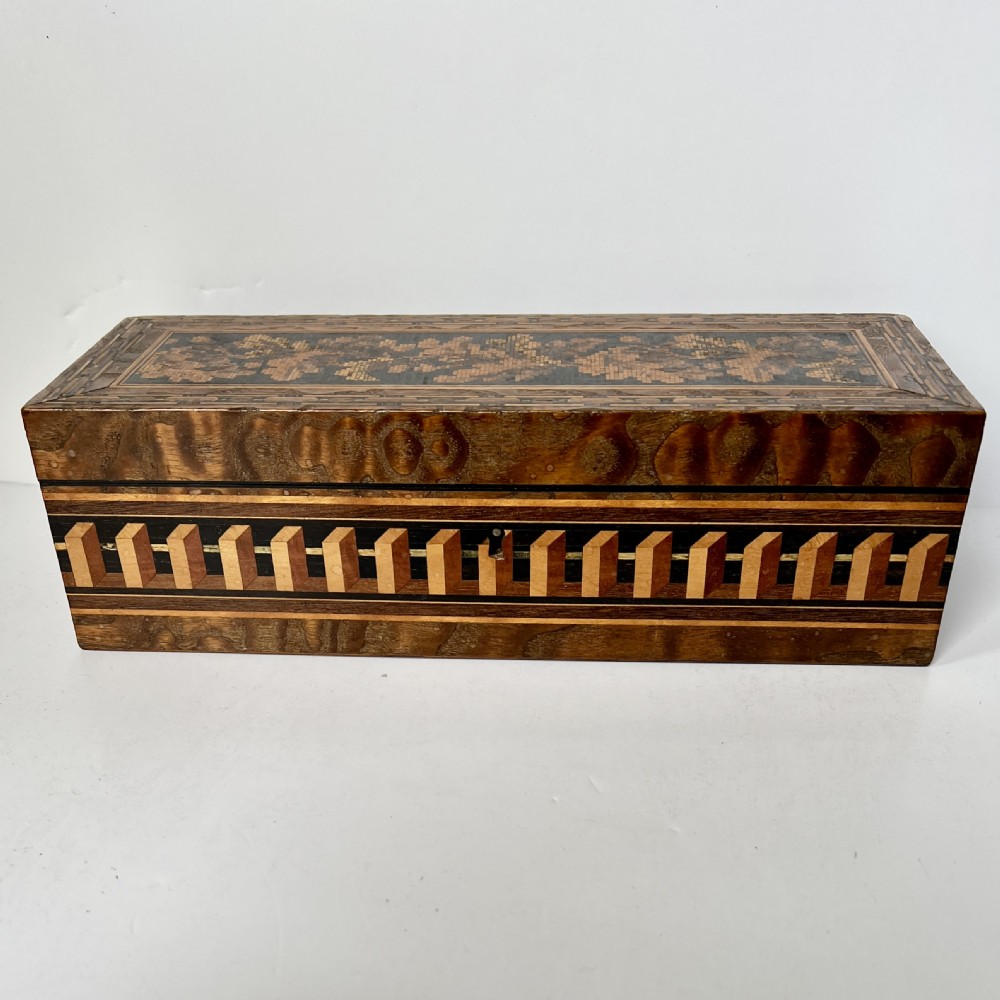 A rectangular Victorian Tunbridge ware wooden glove box with a floral mosaic top panel and a geometric inlaid border. View III