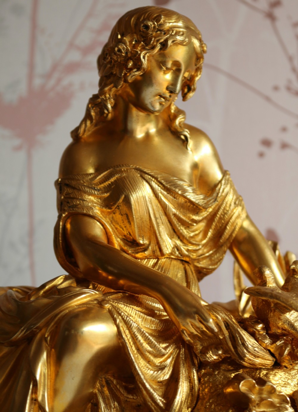 An ornate 19th-century French gilt bronze ormolu mantel clock topped with a classic draped female figure, featuring turquoise porcelain panels painted with flowers and birds. View XI