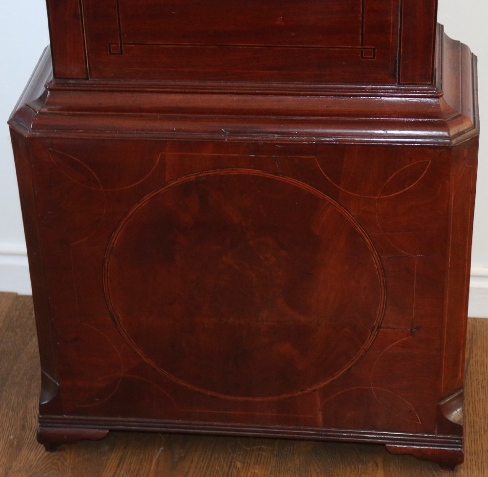 A Georgian mahogany longcase clock featuring a swan-neck pediment, a hand-painted dial with auxiliary subdials, and a rocking ship automaton in the arch. View III