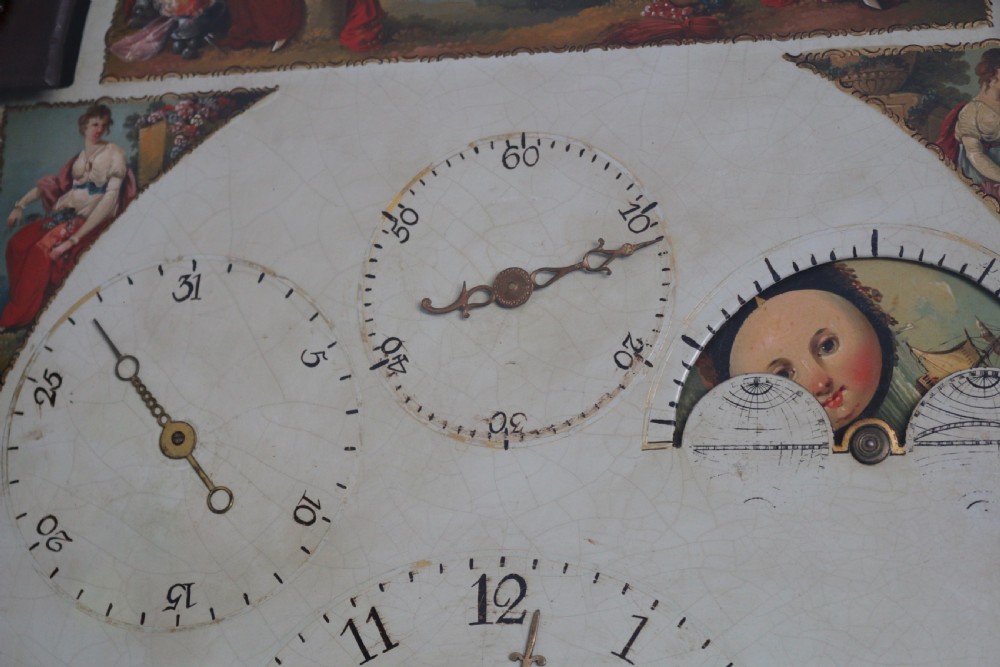 A Georgian mahogany longcase clock featuring a swan-neck pediment, a hand-painted dial with auxiliary subdials, and a rocking ship automaton in the arch. View IV