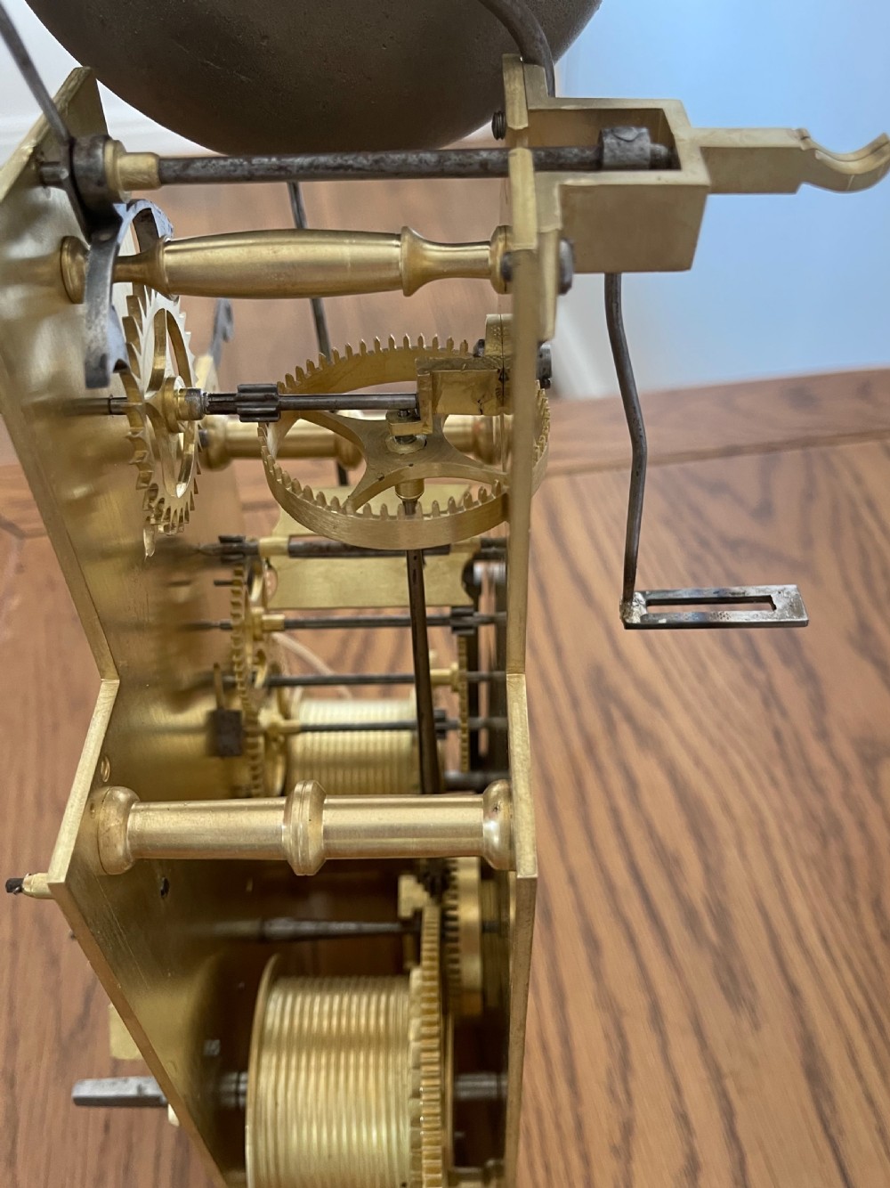 A Georgian mahogany longcase clock featuring a swan-neck pediment, a hand-painted dial with auxiliary subdials, and a rocking ship automaton in the arch. View XI