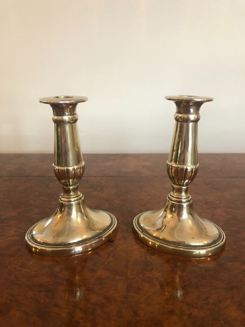 Quality Pair of George III Oval Based Brass Candlesticks