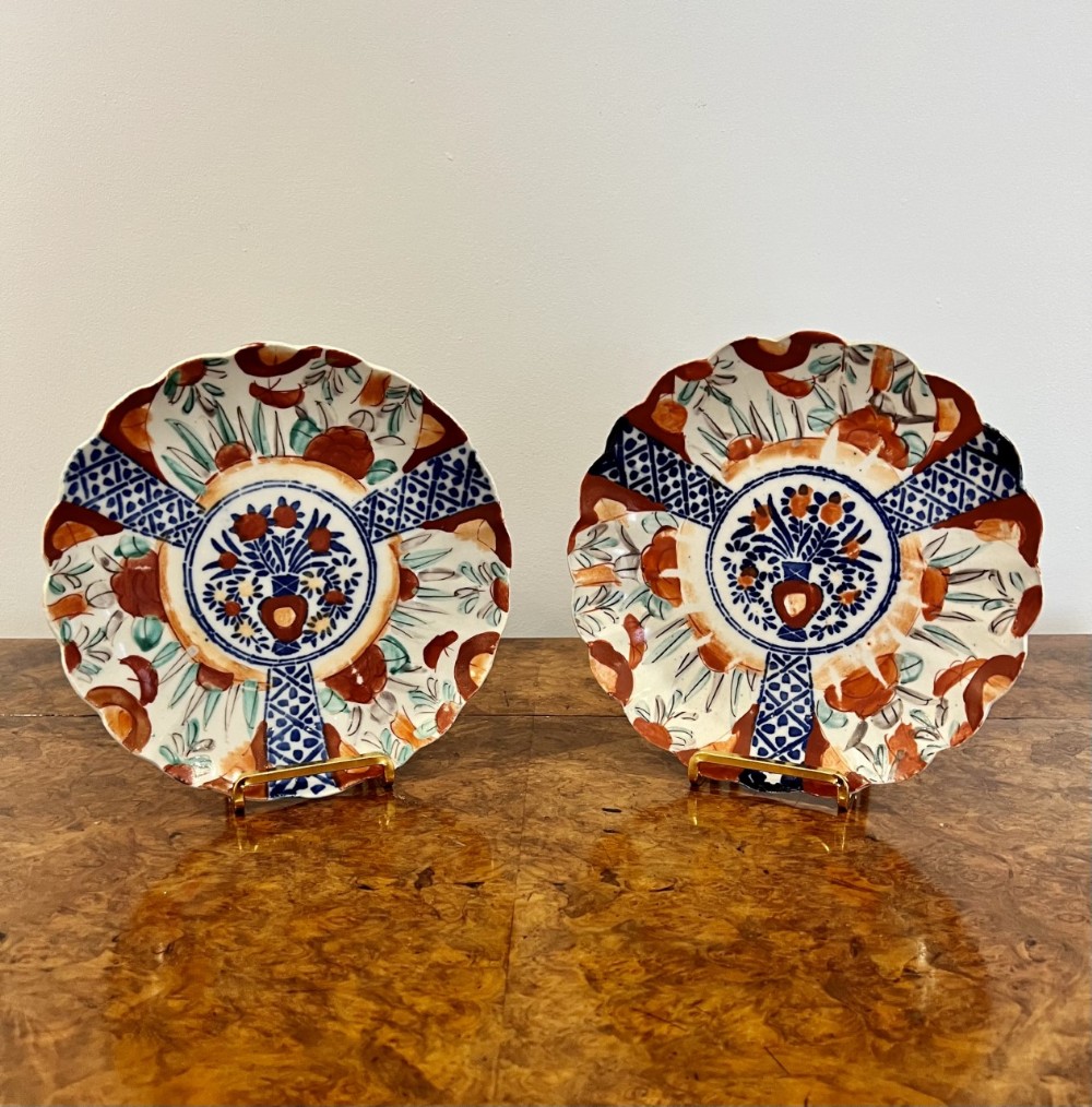 Pair of antique Japanese imari plates with scalloped shaped edges 