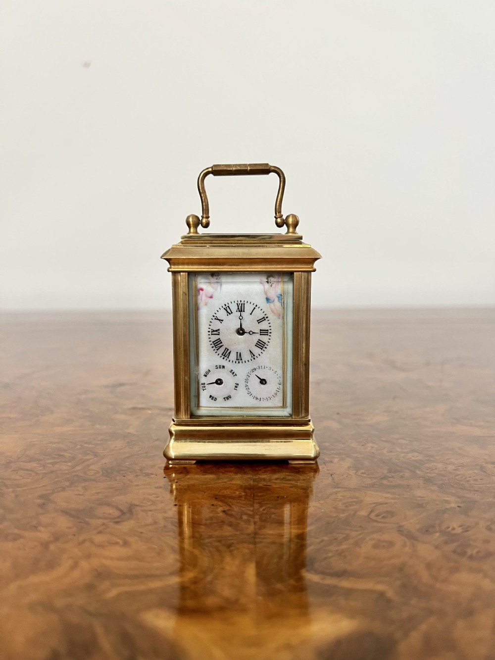 Stunning antique miniature quality brass carriage clock with hand painted porcelain panels 