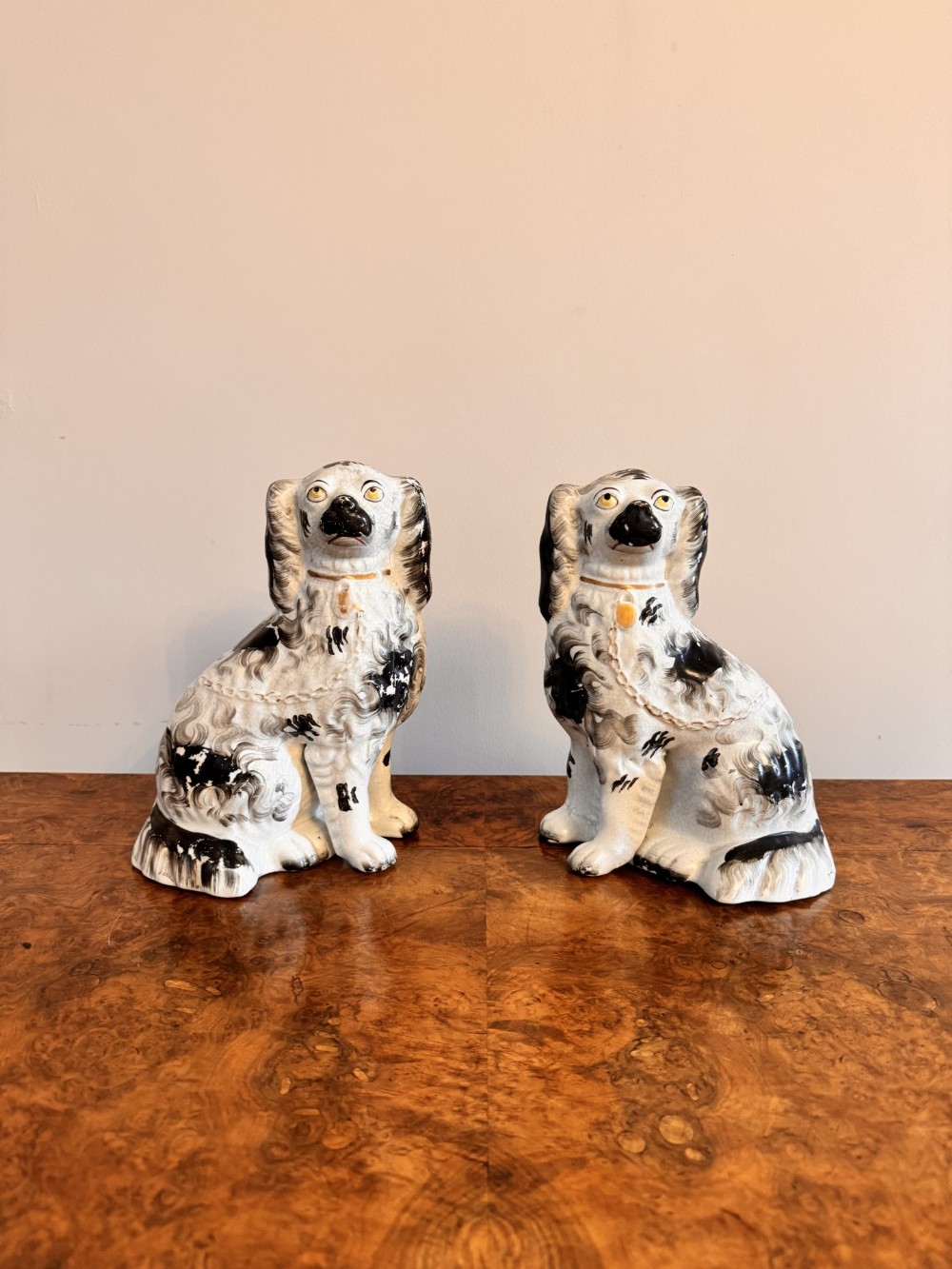 Quality pair of antique Victorian seated Staffordshire spaniels 