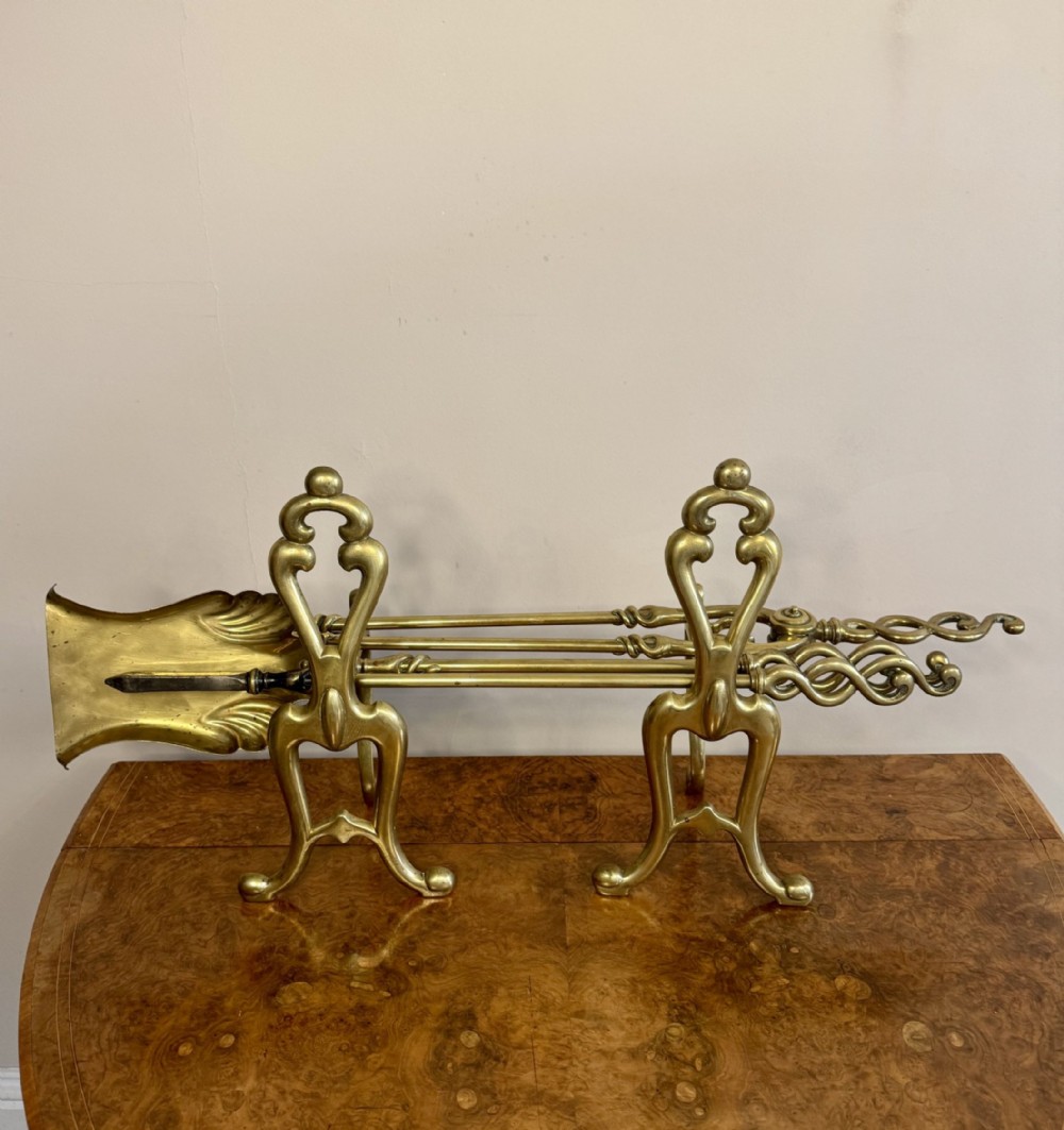 Fine quality antique Edwardian brass fire irons and fire dogs 