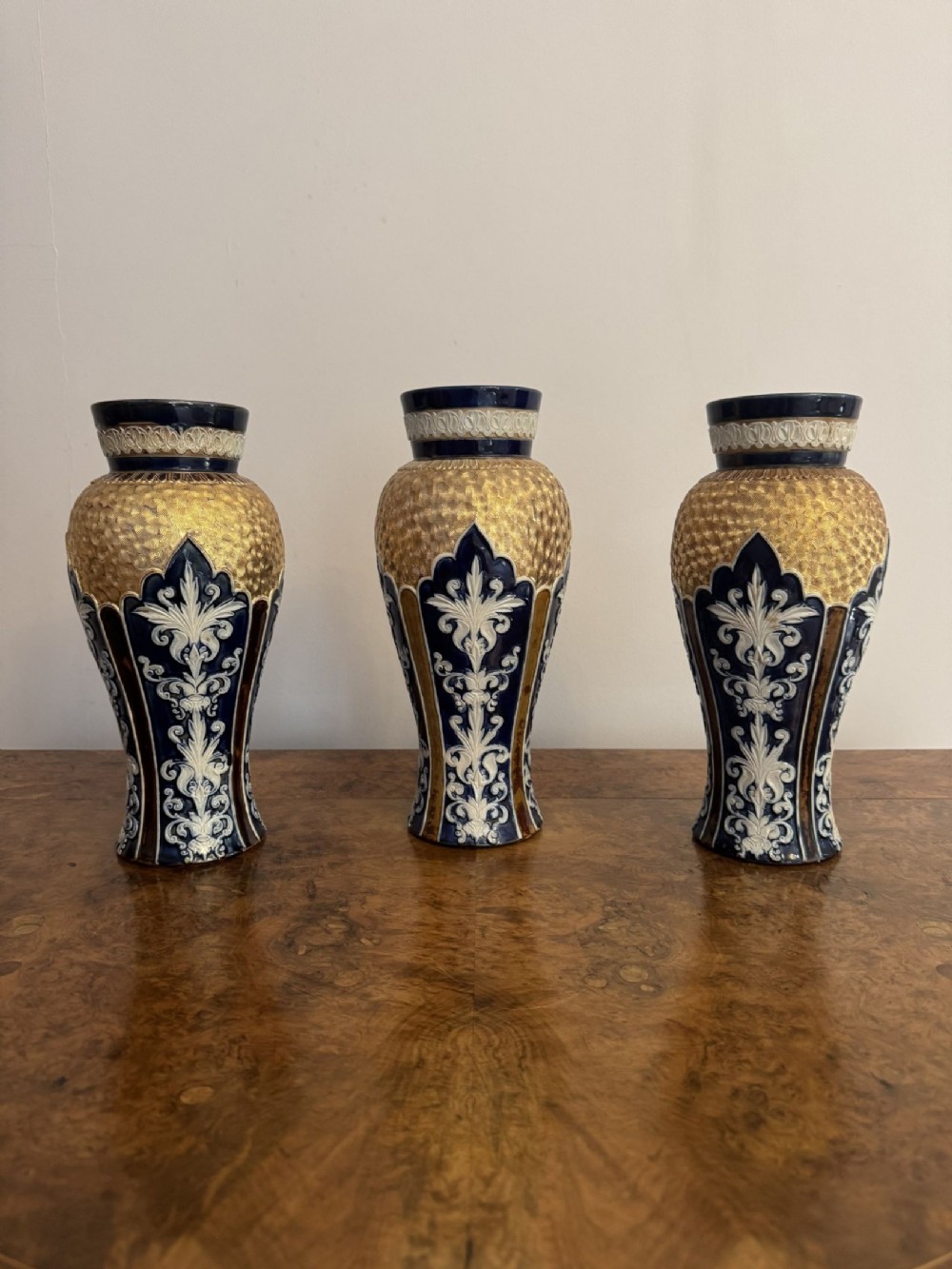 Fantastic quality garniture of three antique Royal Doulton vases 