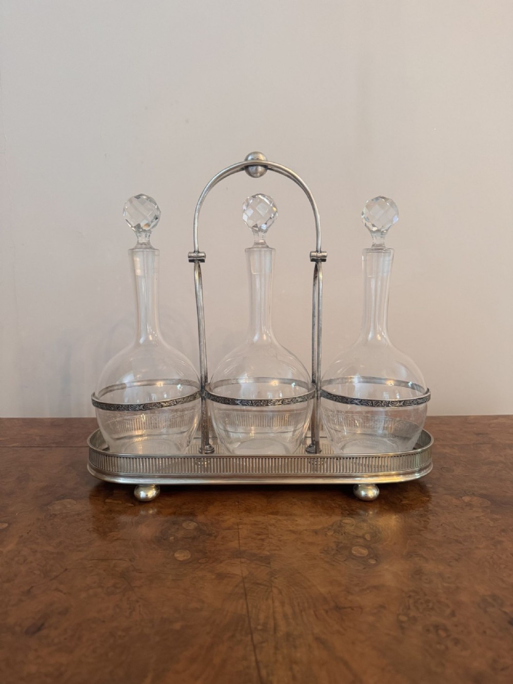 Quality antique Edwardian glass decanters and silver plated stand