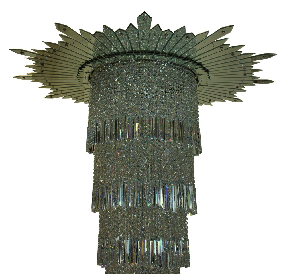 A monumental tiered Art Deco chandelier featuring a sunburst mirrored corona above cascading cylindrical layers of crystal prisms. View VII