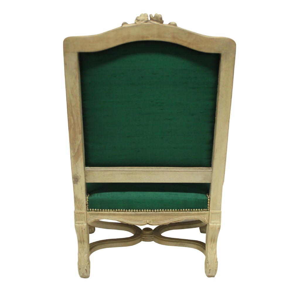 A Louis XIV style carved wood armchair upholstered in vibrant emerald green silk with brass stud details. View III