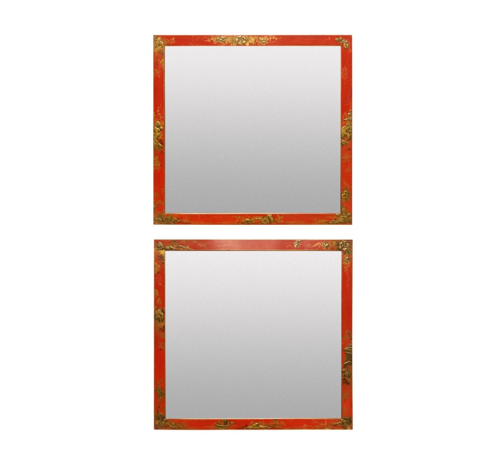 A pair of square wall mirrors featuring bright scarlet japanned frames decorated with gilded chinoiserie foliage and figures.