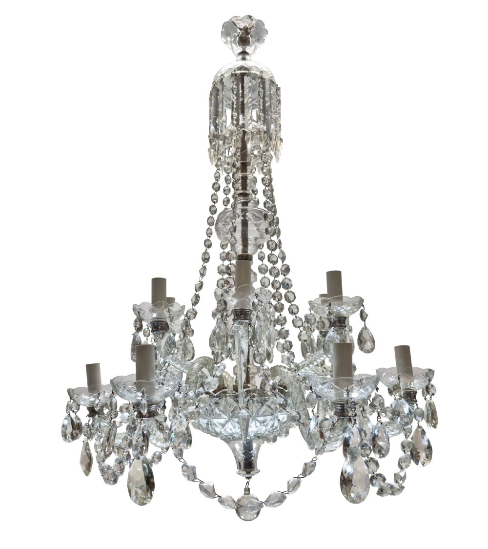 An English twelve-light cut glass chandelier featuring tiered glass arms, faceted crystal drops, and cascading bead swags.