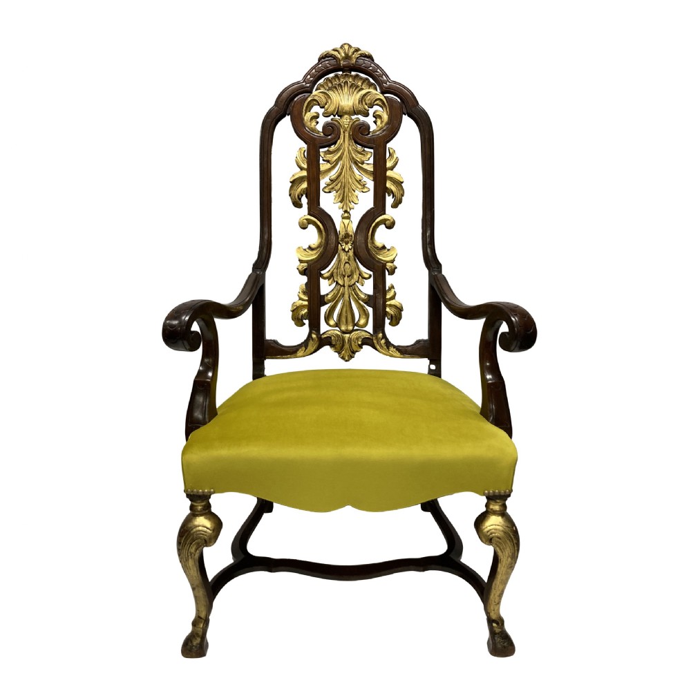 A high-backed Queen Anne style armchair featuring a carved and gilded openwork back splat, scrolled arms, gold cabriole front legs, and an olive green velvet seat.