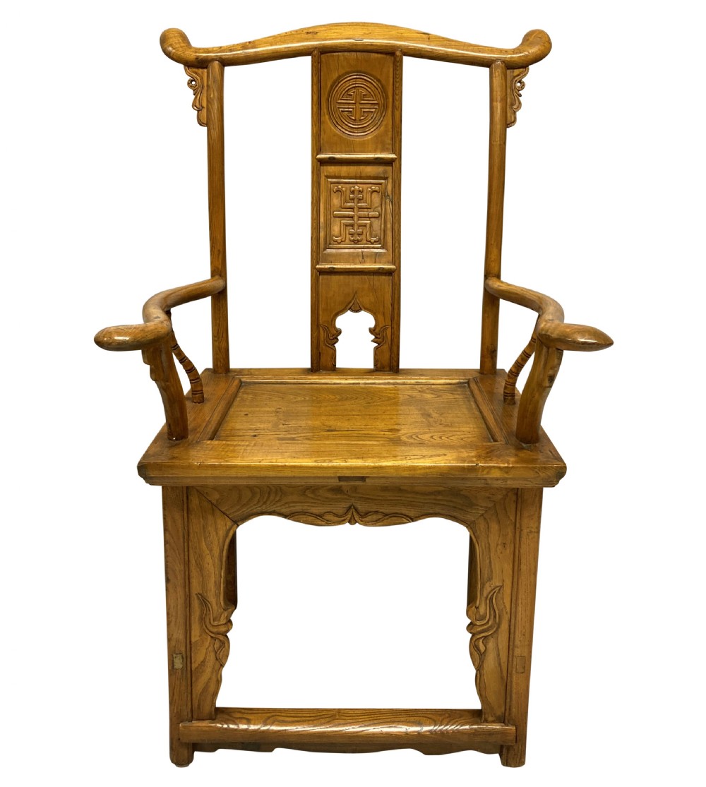 A pair of nineteenth-century Chinese elm yoke-back armchairs featuring carved central back splats and curved armrests. View II