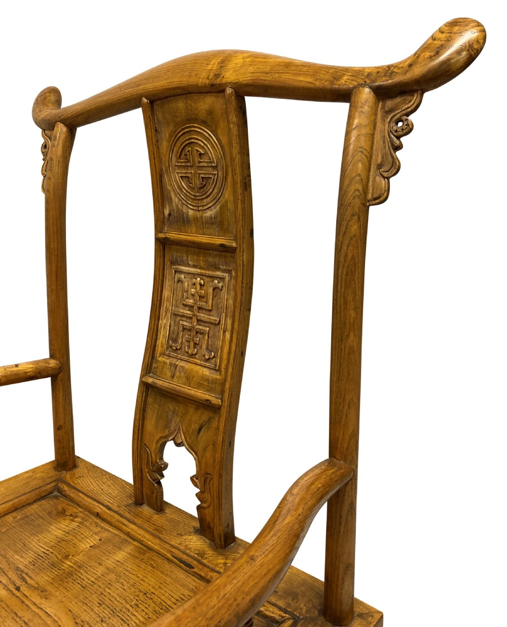 A pair of nineteenth-century Chinese elm yoke-back armchairs featuring carved central back splats and curved armrests. View V