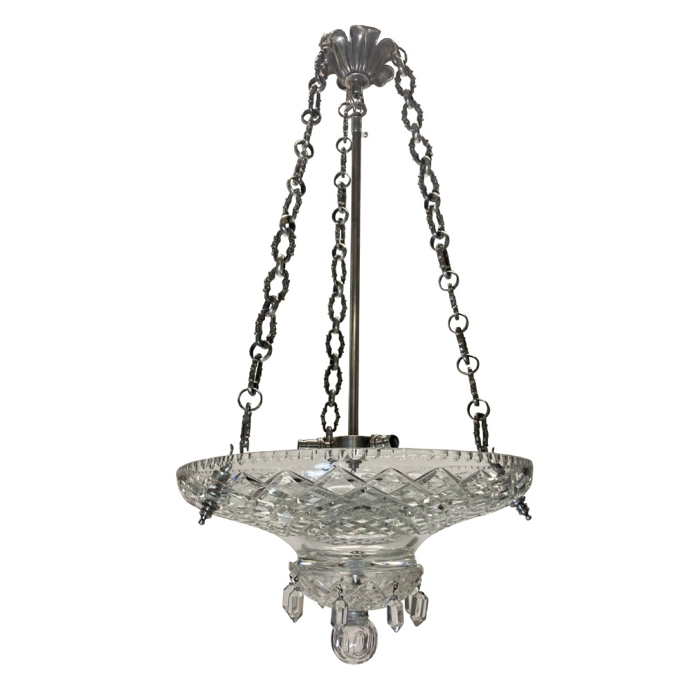 A nineteenth-century cut glass dish light featuring a diamond-patterned crystal bowl suspended by three silver-plated chains from a central rod.