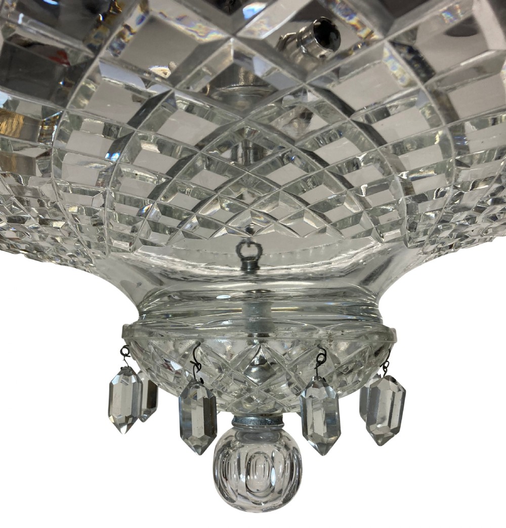 A nineteenth-century cut glass dish light featuring a diamond-patterned crystal bowl suspended by three silver-plated chains from a central rod. View III