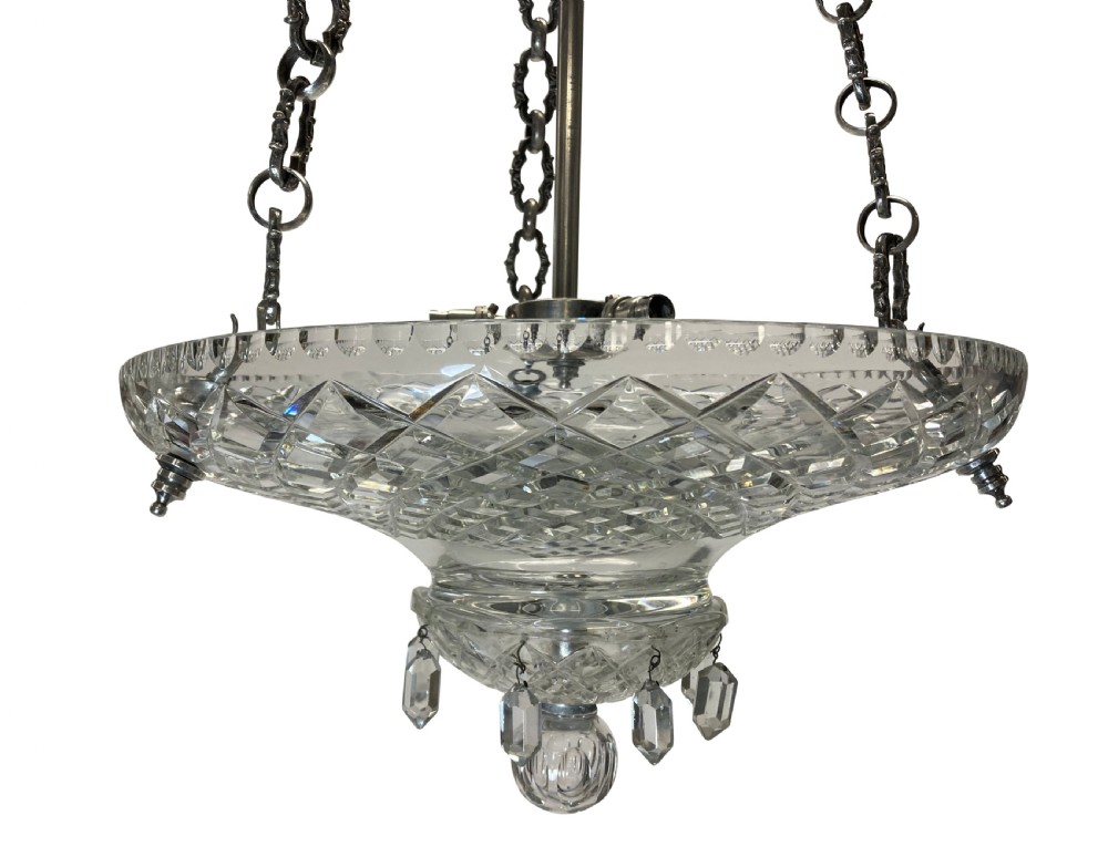 A nineteenth-century cut glass dish light featuring a diamond-patterned crystal bowl suspended by three silver-plated chains from a central rod. View IV