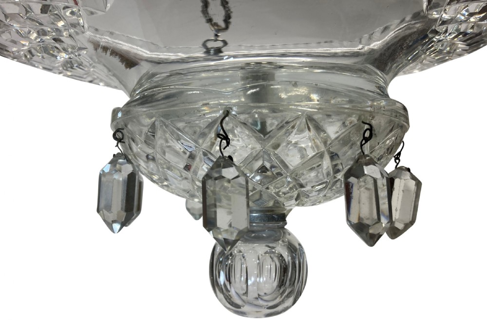A nineteenth-century cut glass dish light featuring a diamond-patterned crystal bowl suspended by three silver-plated chains from a central rod. View VII