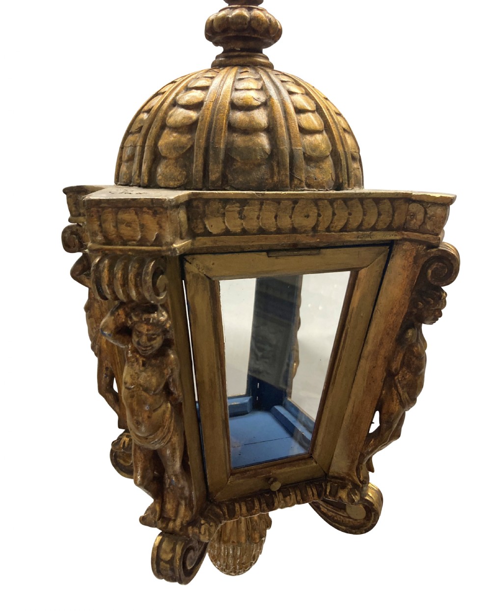 A carved Florentine giltwood hanging lantern with glazed glass panels, flanked by sculpted figures and capped with a domed top and pinecone drop. View II