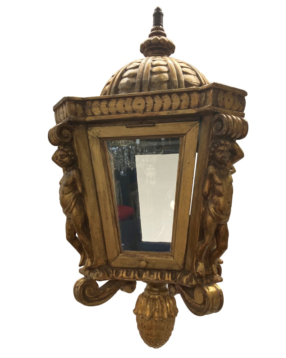A carved Florentine giltwood hanging lantern with glazed glass panels, flanked by sculpted figures and capped with a domed top and pinecone drop. View VI