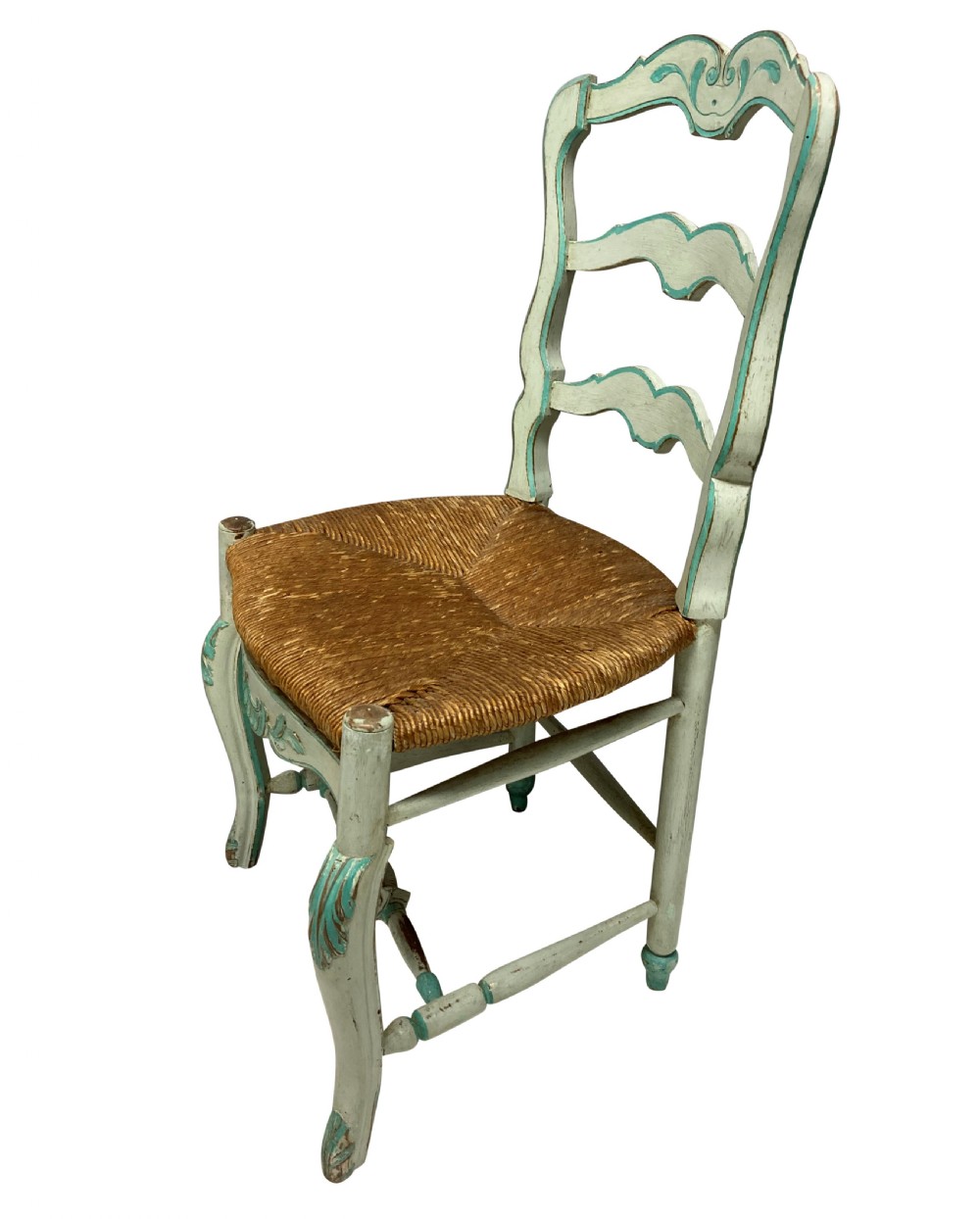 A set of four pale green painted Swedish dining chairs featuring carved wavy ladder backs, woven rush seats, and cabriole legs. View V