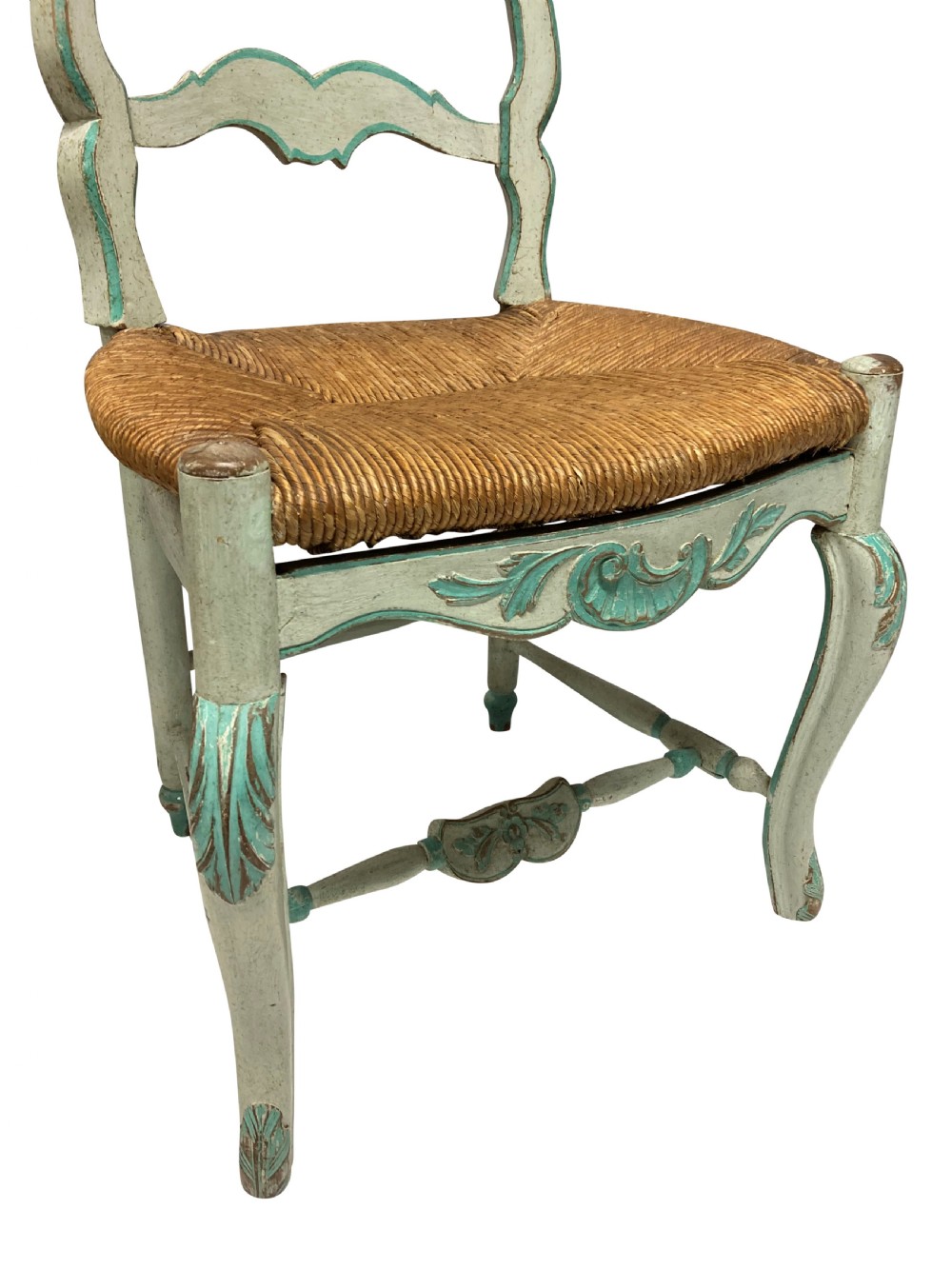 A set of four pale green painted Swedish dining chairs featuring carved wavy ladder backs, woven rush seats, and cabriole legs. View VI