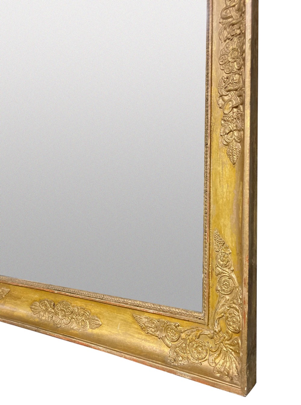 A large rectangular French Napoleon III giltwood mirror featuring relief floral carvings along the frame and a horizontal split glass plate. View II