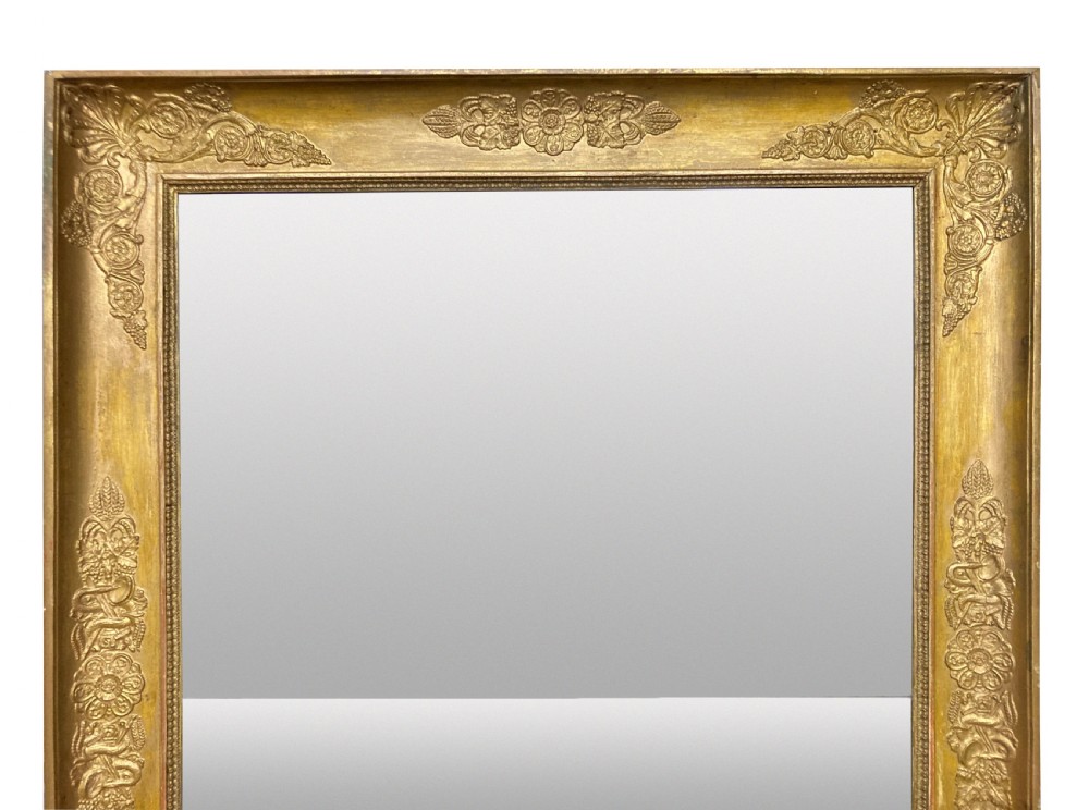A large rectangular French Napoleon III giltwood mirror featuring relief floral carvings along the frame and a horizontal split glass plate. View III