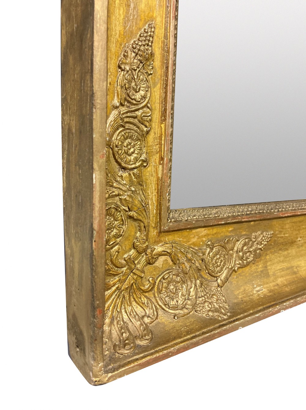 A large rectangular French Napoleon III giltwood mirror featuring relief floral carvings along the frame and a horizontal split glass plate. View IV