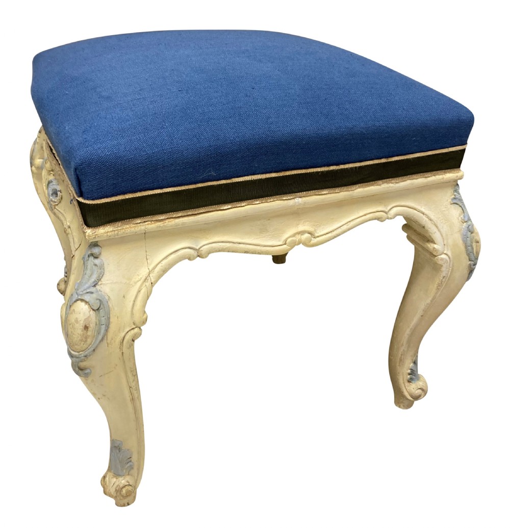 A pair of Louis XV style stools featuring cream and light blue painted carved wooden bases with cabriole legs and royal blue upholstered seats. View IV