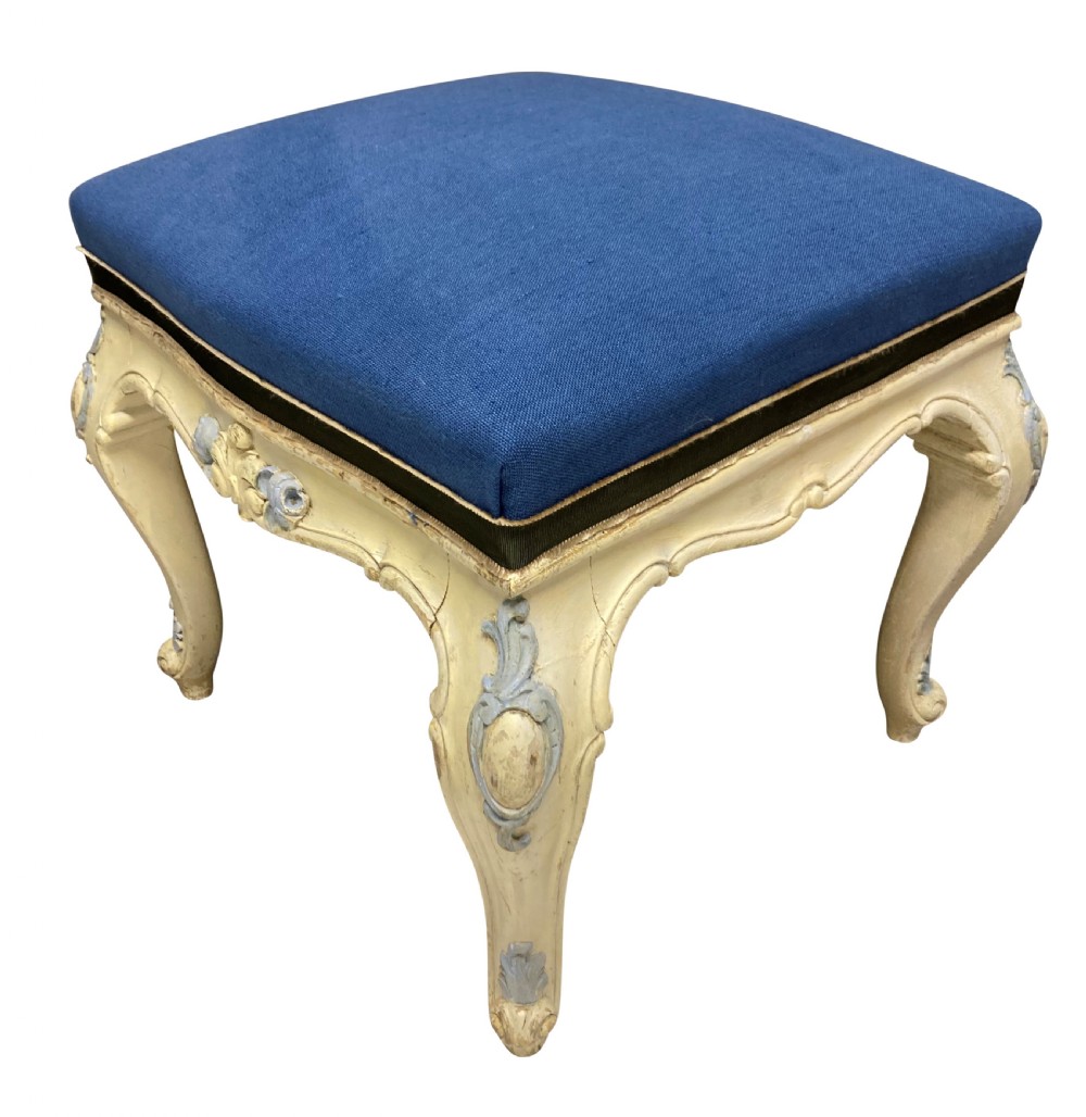 A pair of Louis XV style stools featuring cream and light blue painted carved wooden bases with cabriole legs and royal blue upholstered seats. View V