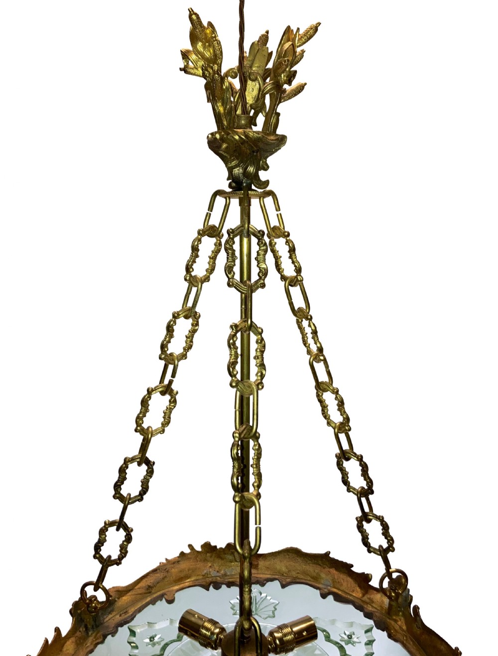 A French Rococo style light fixture featuring a gold-toned ormolu frame with scrolling foliate designs surrounding a central cut-glass bowl suspended by three decorative metal chains. View VI