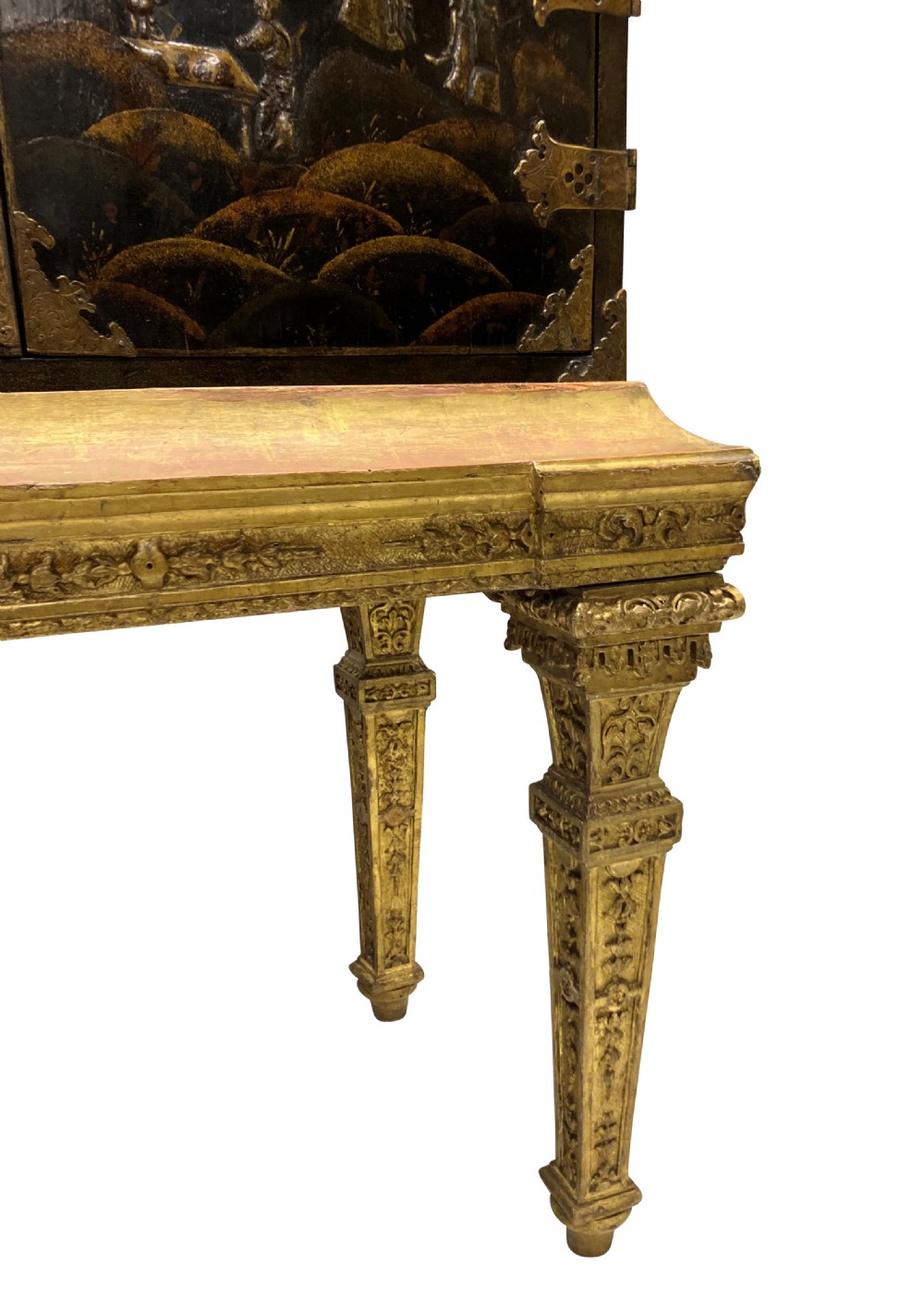 A two-door black japanned cabinet decorated with gold Chinoiserie scenes resting on a carved gilded wooden stand. View X