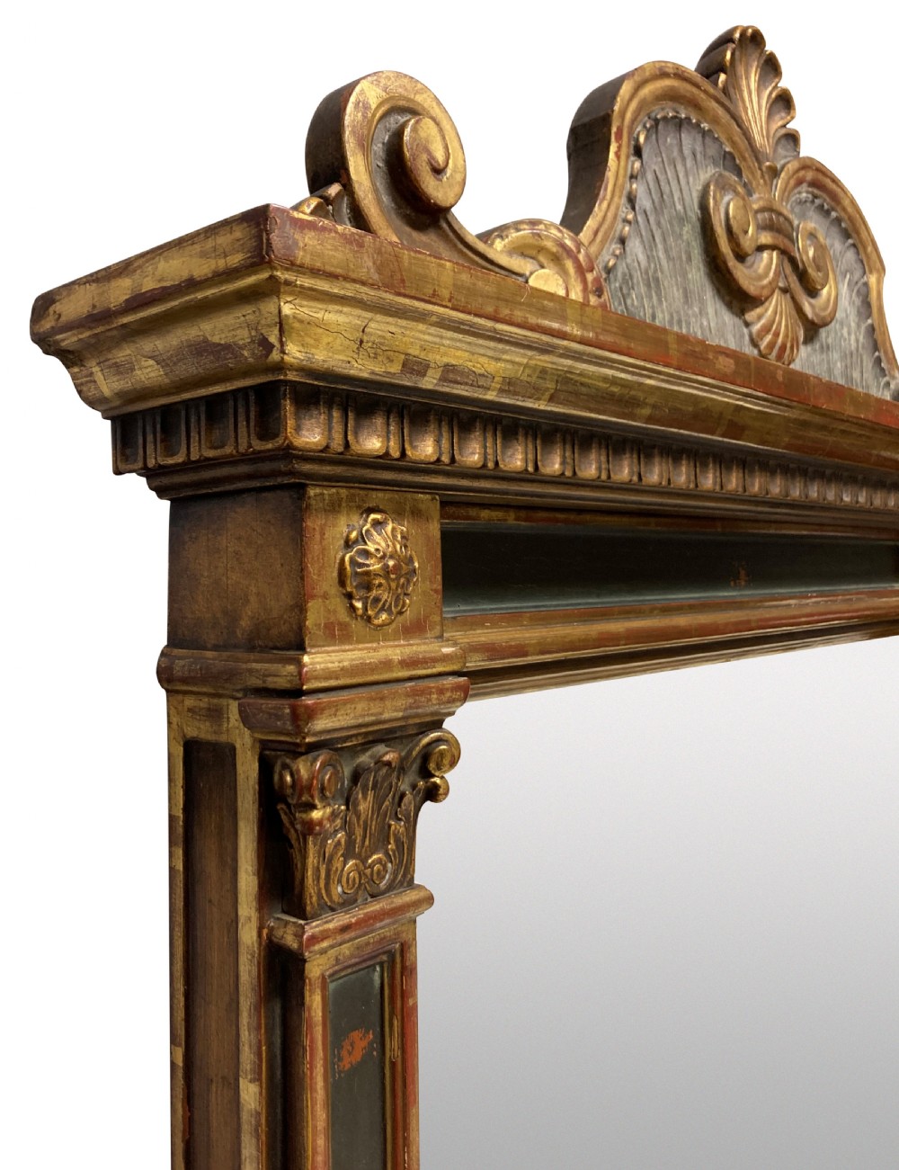 An Italian Renaissance giltwood tabernacle wall mirror featuring carved side pilasters, dark painted panels, and a cresting pediment with a central shell motif. View IV
