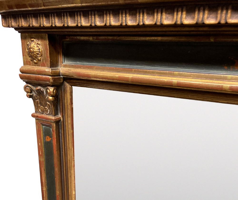An Italian Renaissance giltwood tabernacle wall mirror featuring carved side pilasters, dark painted panels, and a cresting pediment with a central shell motif. View VIII