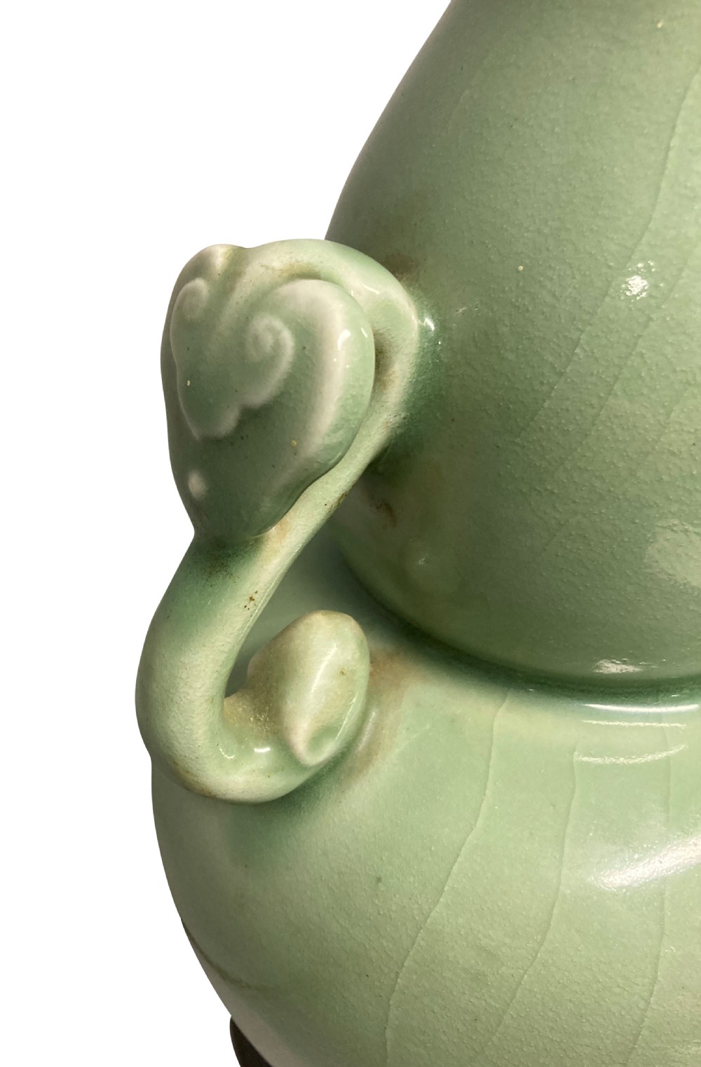 A Chinese pale green celadon ceramic double gourd vase lamp featuring twin scroll handles mounted on a dark wooden base with a brass light fitting. View II