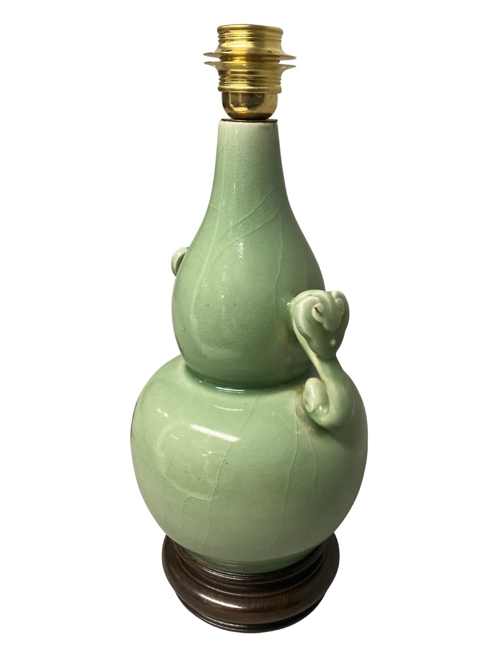 A Chinese pale green celadon ceramic double gourd vase lamp featuring twin scroll handles mounted on a dark wooden base with a brass light fitting. View IV
