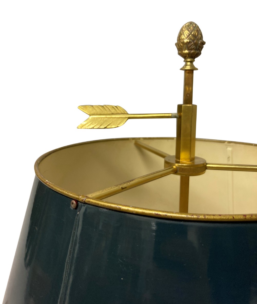 A French gilt brass bouillotte lamp with three candle-style light sockets and a dark green painted metal shade mounted on a central stem with an arrow key motif. View III